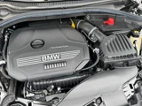 2020 BMW 1 Series 118i Play White Sedan for sale, Japanese used car export - photo 8 of 9 | GULJI TRADERS
