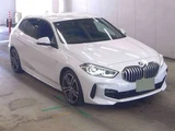 2022 BMW 1 Series 118d M Sport White Sedan for sale, Japanese used car export - photo 1 of 6 | GULJI TRADERS