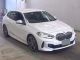 2023 BMW 1 Series 118i M Sport White Sedan for sale, Japanese used car export - photo 1 of 5 | GULJI TRADERS