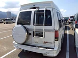1996 GMC Safari American Road 4WD White Sedan for sale, Japanese used car export - photo 5 of 6 | GULJI TRADERS