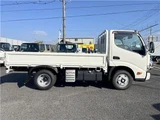 2025 Hino Dutro 2-ton flatbed truck, mitigation braking system, backup camera, 6-speed manual transmission, registered but unused. White Truck for sale, Japanese used car export - photo 4 of 43 | GULJI TRADERS