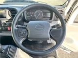 2025 Hino Dutro 2-ton flatbed truck, mitigation braking system, backup camera, 6-speed manual transmission, registered but unused. White Truck for sale, Japanese used car export - photo 15 of 43 | GULJI TRADERS