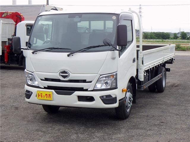 2025 Hino Dutro Flatbed wide extra-long 4.5t registered unused vehicle, current model. White Truck for sale, Japanese used car export - photo 1 of 51 | GULJI TRADERS