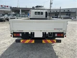 2025 Hino Dutro Flatbed truck with approximately 500km mileage. White Truck for sale, Japanese used car export - photo 2 of 29 | GULJI TRADERS