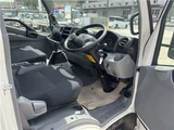 2025 Hino Dutro Flatbed truck with approximately 500km mileage. White Truck for sale, Japanese used car export - photo 3 of 29 | GULJI TRADERS