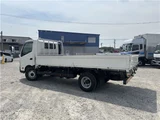 2025 Hino Dutro Flatbed truck with approximately 500km mileage. White Truck for sale, Japanese used car export - photo 8 of 29 | GULJI TRADERS