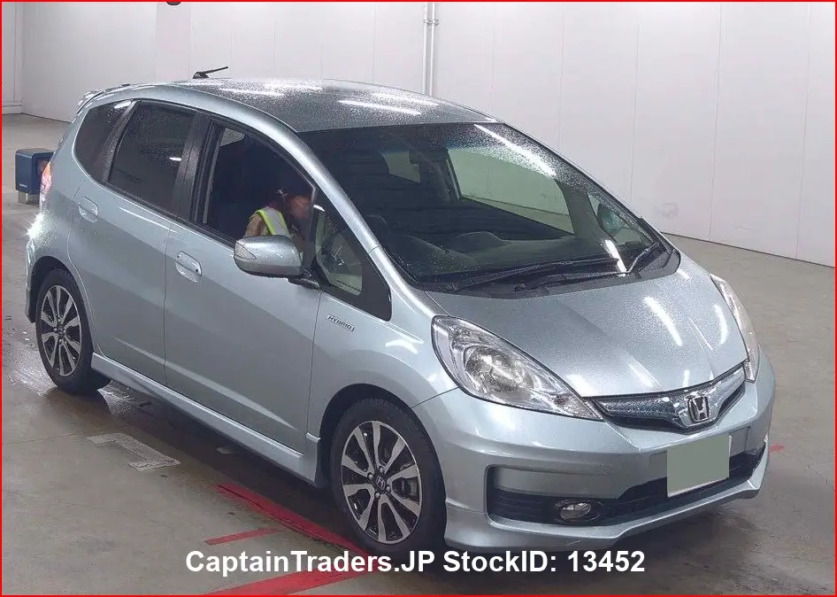 2012 Honda Fit Hibrid - photo 1 2012 Honda Fit Hibrid Silver Sedan for sale, Japanese used car export | GULJI TRADERS