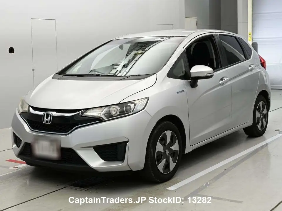 2017 Honda Fit Hibrid Silver Sedan for sale, Japanese used car export - photo 1 of 19 | GULJI TRADERS