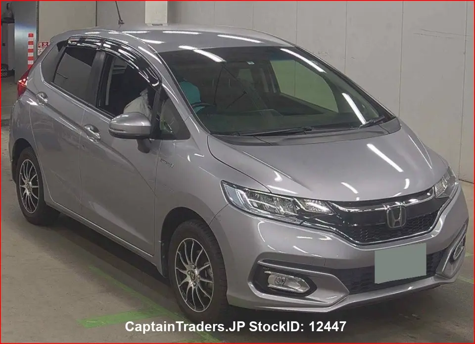 2018 Honda Fit Hibrid - photo 1 2018 Honda Fit Hibrid Silver Sedan for sale, Japanese used car export - photo 1 of 32 | GULJI TRADERS
