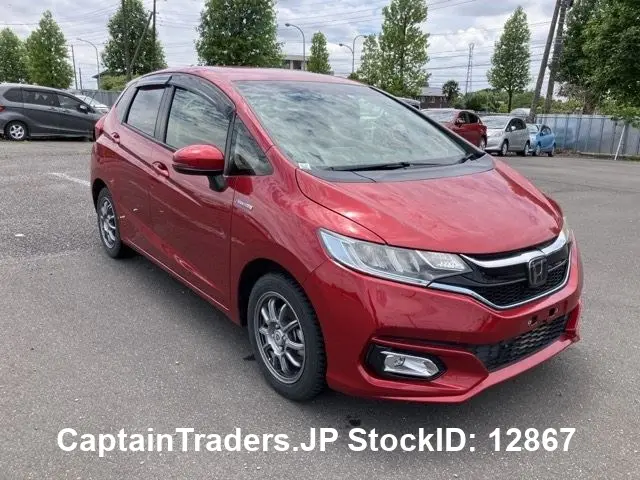 2018 Honda Fit Hibrid - photo 1 2018 Honda Fit Hibrid Red Sedan for sale, Japanese used car export | GULJI TRADERS