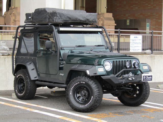 2000 Jeep Wrangler Sport - photo 1 2000 Jeep Wrangler Sport Jeep for sale, Japanese used car export - photo 1 of 19 | GULJI TRADERS