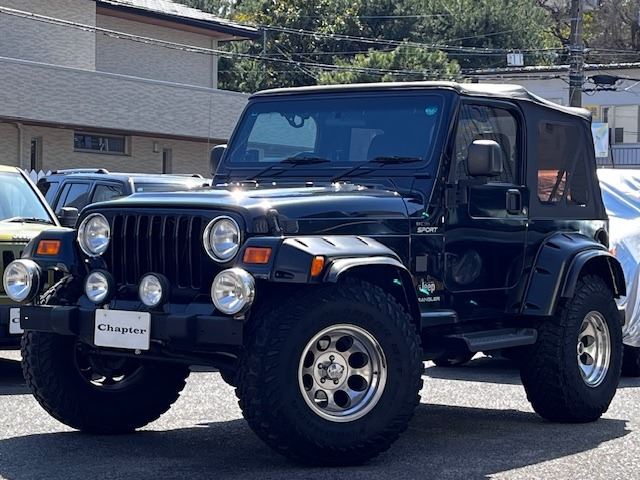 2002 Jeep Wrangler Sport 4WD - photo 1 2002 Jeep Wrangler Sport 4WD Jeep for sale, Japanese used car export - photo 1 of 23 | GULJI TRADERS