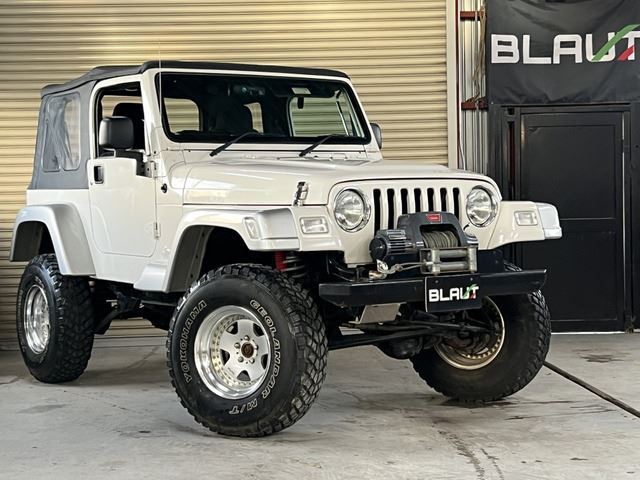 2002 Jeep Wrangler Sport 4WD - photo 1 2002 Jeep Wrangler Sport 4WD Jeep for sale, Japanese used car export - photo 1 of 52 | GULJI TRADERS