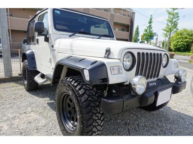 2003 Jeep Wrangler Sport - photo 1 2003 Jeep Wrangler Sport Jeep for sale, Japanese used car export - photo 1 of 50 | GULJI TRADERS