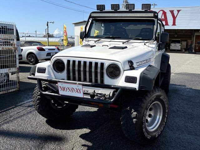 2004 Jeep Wrangler Sport 4WD - photo 1 2004 Jeep Wrangler Sport 4WD Jeep for sale, Japanese used car export - photo 1 of 20 | GULJI TRADERS