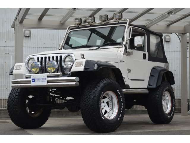 2006 Jeep Wrangler Sport 17AW 37A - photo 1 2006 Jeep Wrangler Sport 17AW 37A Jeep for sale, Japanese used car export - photo 1 of 50 | GULJI TRADERS