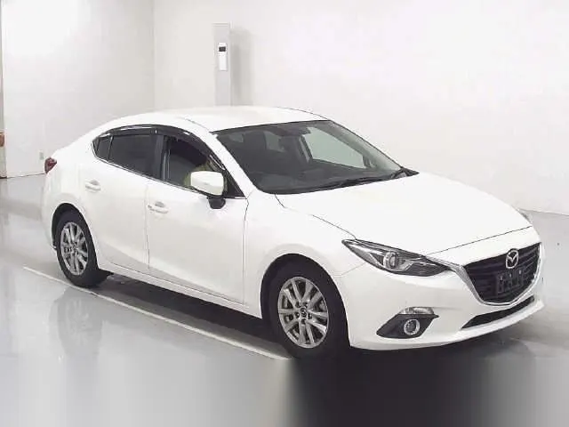 2013 Mazda Axlea 15 S - photo 1 2013 Mazda Axlea 15 S Pearl Sedan for sale, Japanese used car export - photo 1 of 7 | GULJI TRADERS