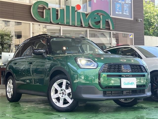 2025 MINI Hatch Mini Countryman D - photo 1 2025 MINI Hatch Mini Countryman D Green SUV for sale, Japanese used car export - photo 1 of 24 | GULJI TRADERS