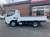 2026 Mitsubishi Fuso Canter 2-ton capacity, flatbed, low-floor, manual transmission (MT5), under 5 tons. White Truck for sale, Japanese used car export - photo 8 of 69 | GULJI TRADERS