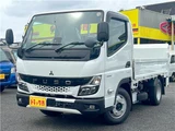 2026 Mitsubishi Fuso Canter 2-ton flatbed with vertical gate, collision mitigation braking, 5-speed manual transmission, unused vehicle. White Truck for sale, Japanese used car export - photo 1 of 51 | GULJI TRADERS