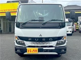 2026 Mitsubishi Fuso Canter 2-ton flatbed with vertical gate, collision mitigation braking, 5-speed manual transmission, unused vehicle. White Truck for sale, Japanese used car export - photo 2 of 51 | GULJI TRADERS
