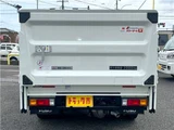 2026 Mitsubishi Fuso Canter 2-ton flatbed with vertical gate, collision mitigation braking, 5-speed manual transmission, unused vehicle. White Truck for sale, Japanese used car export - photo 5 of 51 | GULJI TRADERS