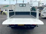 2026 Mitsubishi Fuso Canter 2-ton flatbed with vertical gate, collision mitigation braking, 5-speed manual transmission, unused vehicle. White Truck for sale, Japanese used car export - photo 6 of 51 | GULJI TRADERS