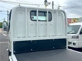 2026 Mitsubishi Fuso Canter 2-ton flatbed with vertical gate, collision mitigation braking, 5-speed manual transmission, unused vehicle. White Truck for sale, Japanese used car export - photo 12 of 51 | GULJI TRADERS