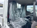 2026 Mitsubishi Fuso Canter 2-ton flatbed with vertical gate, collision mitigation braking, 5-speed manual transmission, unused vehicle. White Truck for sale, Japanese used car export - photo 21 of 51 | GULJI TRADERS
