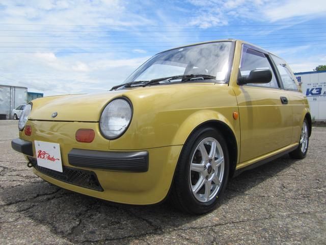 1987 Nissan BE-1 Base - photo 1 1987 Nissan BE-1 Base Sedan for sale, Japanese used car export | GULJI TRADERS