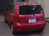 2009 Nissan Note 4WD X Red Van for sale, Japanese used car export - photo 6 of 6 | GULJI TRADERS