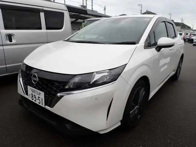2023 Nissan Note X - photo 1 2023 Nissan Note X Pearl Van for sale, Japanese used car export - photo 1 of 10 | GULJI TRADERS
