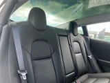 2021 Tesla Model 3 STANDARD RANGE + White Sedan for sale, Japanese used car export - photo 26 of 30 | GULJI TRADERS