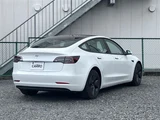 2021 Tesla Model 3 STANDARD RANGE + White Sedan for sale, Japanese used car export - photo 5 of 30 | GULJI TRADERS