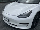 2021 Tesla Model 3 STANDARD RANGE + White Sedan for sale, Japanese used car export - photo 11 of 30 | GULJI TRADERS
