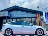 2021 Tesla Model 3 Long range White Sedan for sale, Japanese used car export - photo 7 of 9 | GULJI TRADERS
