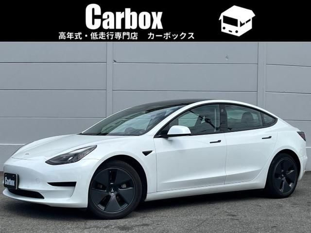 2021 Tesla Model 3 Standard Range Plus - photo 1 2021 Tesla Model 3 Standard Range Plus Pearl Sedan for sale, Japanese used car export - photo 1 of 4 | GULJI TRADERS