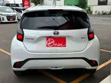 2025 Toyota Aqua 1.5 G E-Four 4WD White Sedan for sale, Japanese used car export - photo 18 of 53 | GULJI TRADERS