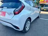 2025 Toyota Aqua 1.5 G E-Four 4WD White Sedan for sale, Japanese used car export - photo 28 of 41 | GULJI TRADERS