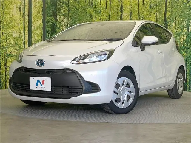 2025 Toyota Aqua X - photo 1 2025 Toyota Aqua X Pearl Sedan for sale, Japanese used car export - photo 1 of 30 | GULJI TRADERS