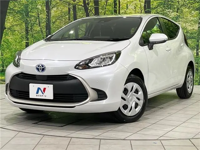 2025 Toyota Aqua G - photo 1 2025 Toyota Aqua G Pearl Sedan for sale, Japanese used car export - photo 1 of 30 | GULJI TRADERS