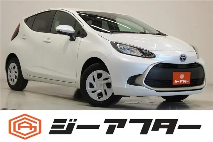 2025 Toyota Aqua 1.5 G 4WD White Sedan for sale, Japanese used car export - photo 1 of 30 | GULJI TRADERS