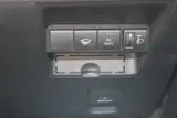 2025 Toyota Aqua 1.5 G E-FOUR 4WD White Sedan for sale, Japanese used car export - photo 7 of 30 | GULJI TRADERS