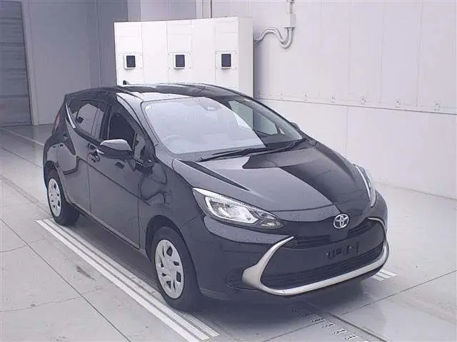 2025 Toyota Aqua 4WD G - photo 1 2025 Toyota Aqua 4WD G Black Sedan for sale, Japanese used car export - photo 1 of 11 | GULJI TRADERS
