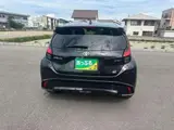 2025 Toyota Aqua 1.5 GR Sport Black Sedan for sale, Japanese used car export - photo 7 of 9 | GULJI TRADERS