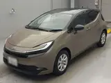 2026 Toyota Aqua Z Brown Sedan for sale, Japanese used car export - photo 1 of 15 | GULJI TRADERS