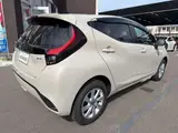 2026 Toyota Aqua 1.5 Z E-Four 4WD Brown Sedan for sale, Japanese used car export - photo 7 of 24 | GULJI TRADERS
