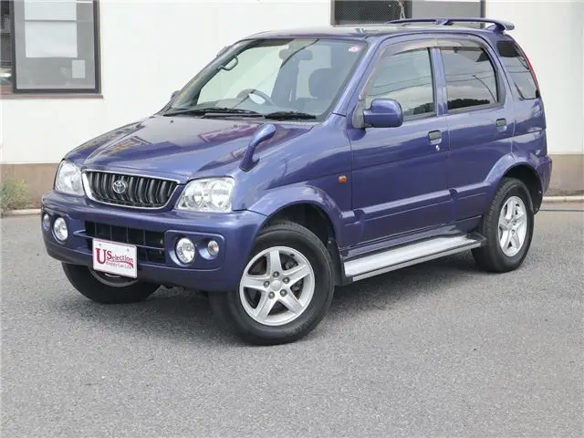 2004 Toyota Cami 1300Q / Side steps / Rear spoiler / Aluminum wheels / Spare spare tire / 4WD - photo 1 2004 Toyota Cami 1300Q / Side steps / Rear spoiler / Aluminum wheels / Spare spare tire / 4WD Blue Sedan for sale, Japanese used car export - photo 1 of 50 | GULJI TRADERS