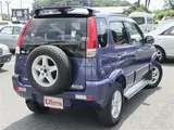 2004 Toyota Cami 1300Q / Side steps / Rear spoiler / Aluminum wheels / Spare spare tire / 4WD Blue Sedan for sale, Japanese used car export - photo 2 of 50 | GULJI TRADERS