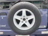 2004 Toyota Cami 1300Q / Side steps / Rear spoiler / Aluminum wheels / Spare spare tire / 4WD Blue Sedan for sale, Japanese used car export - photo 35 of 50 | GULJI TRADERS